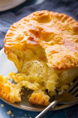  Cheshire Cheese and Onion Pie: A Savoury Symphony of Gooey Cheese and Sweet Caramelized Onions!